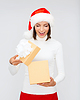 Удивлен женщина в шляпу Санта помощник с подарочной коробке | Фото