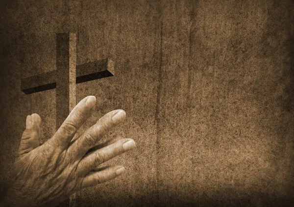 Молиться руки с Креста — стоковое фото