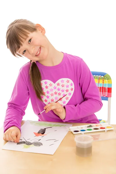 Школа девушка рисует краски и кисти на кусок бумаги Ситт — стоковое фото