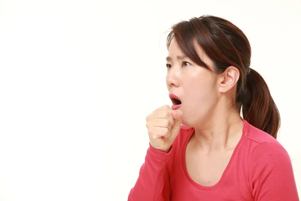 Middle aged Japanese woman coughing　 — стоковое фото