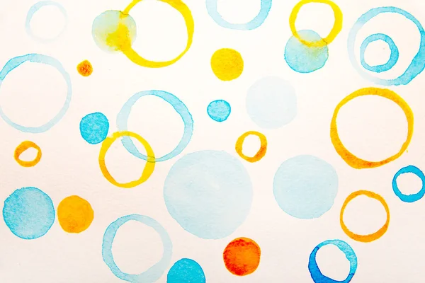 Цвет воды синие и желтые круги — стоковое фото