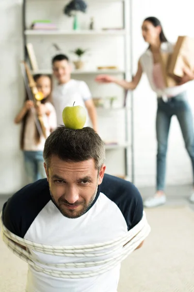 Tied Father Sitting Floor Apple Head Target Home Parenthood Concept — стоковое фото