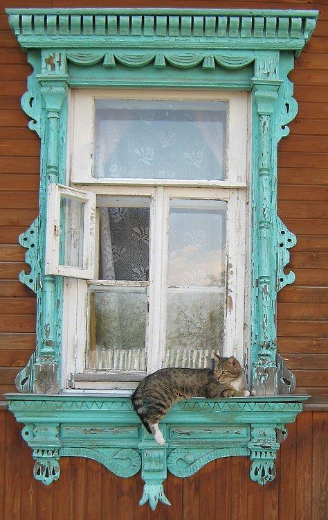 Like Karl Pilkington....why would I want live inside this...if I can live across from it and see this as my view..? Turqiouse framed, rustic window and kittay