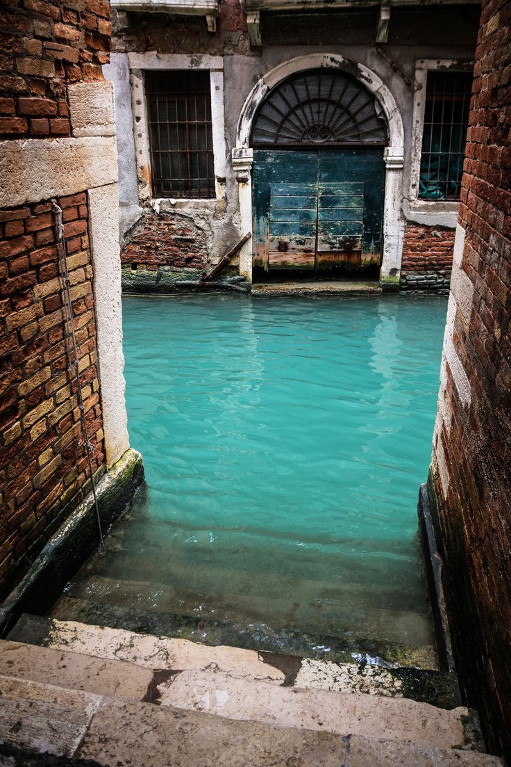 Turquoise Canal in Venice, Italy. From