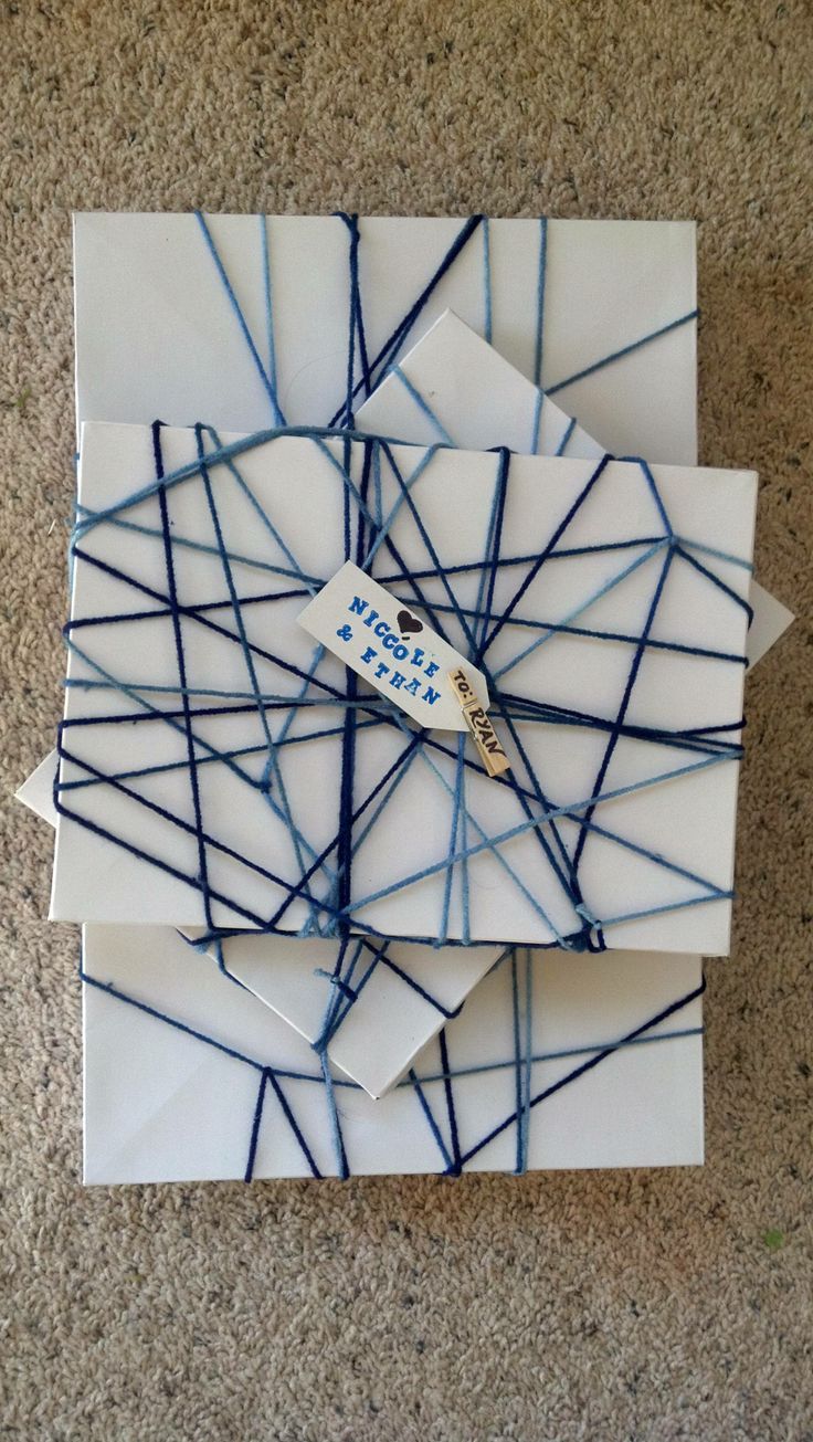 Gift Wrap. Wrap each individual box, then stack and weave together. Add a tiny clothespin and tag.
