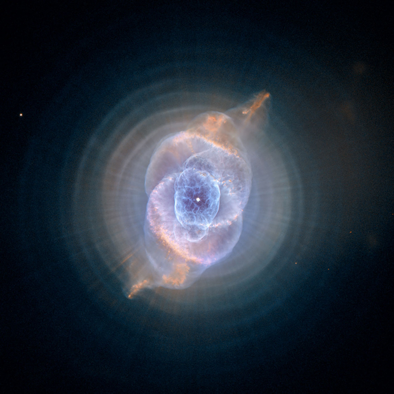 In this detailed view from the NASA/ESA Hubble Space Telescope, the so-called Cat's Eye Nebula looks like the penetrating eye of the disembodied sorcerer Sauron from the film adaptation of "Lord of the Rings." The nebula, formally catalogued NGC 6543, is every bit as inscrutable as the J.R.R. Tolkien phantom character. Although the Cat's Eye Nebula was among the first planetary nebula ever to be discovered, it is one of the most complex planetary nebulae ever seen in space. A planetary nebula forms when Sun-like stars gently eject their outer gaseous layers to form bright nebulae with amazing twisted shapes.