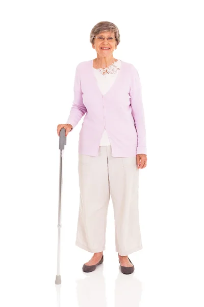 Старший женщина с ходьбой тростника, изолированные на белом фоне — стоковое фото