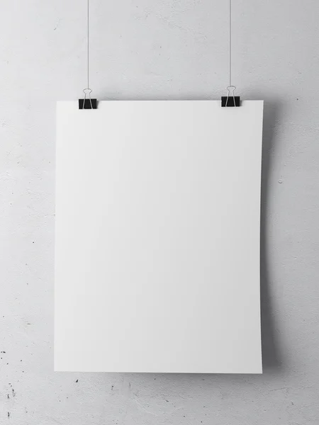 Бумага на белой стене — стоковое фото