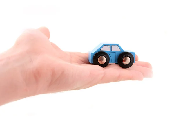 Человек руку с игрушечный автомобиль — стоковое фото