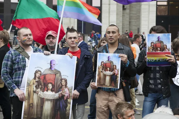 Protestant holds poster and icons with image of Pussy Riot — стоковое фото