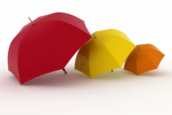 Три разноцветные зонтики — стоковое фото