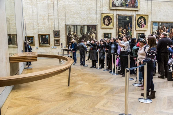 Visitors take photo of "Mona Lisa" Стоковая Картинка