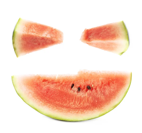 Счастливое лицо из ломтиков арбуза — стоковое фото