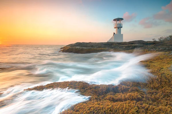 Морской маяк на закате Стоковое Изображение