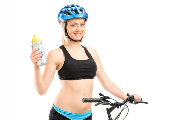 Женский велосипедист Холдинг воды Лицензионные Стоковые Изображения