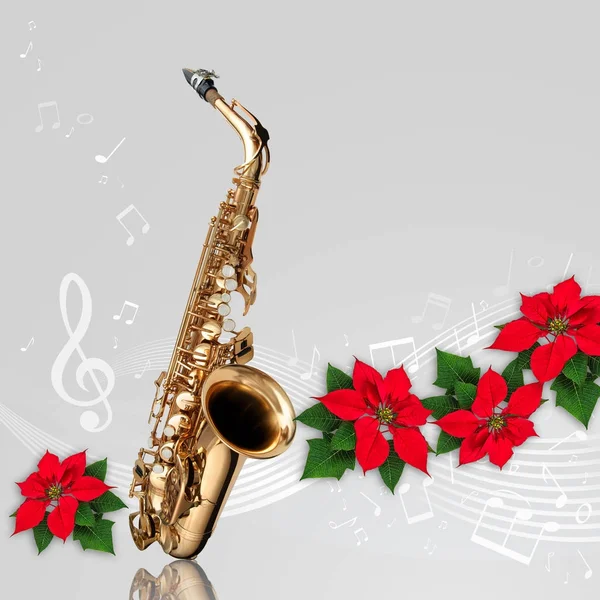 Саксофон с Поинсеттиа красный цветок Рождество орнамент — стоковое фото