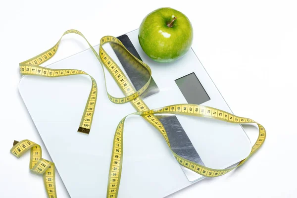 Цифровые весы и измерительная лента Стоковое Фото