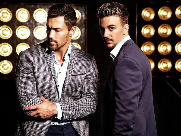 Two handsome men in elegant suits — стоковое фото