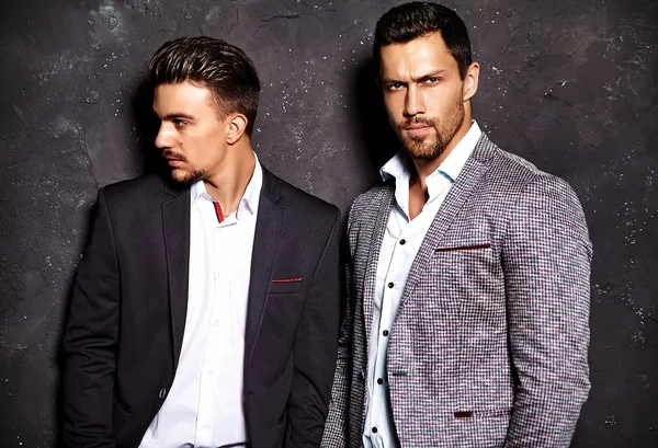 Two handsome men in elegant suits — стоковое фото