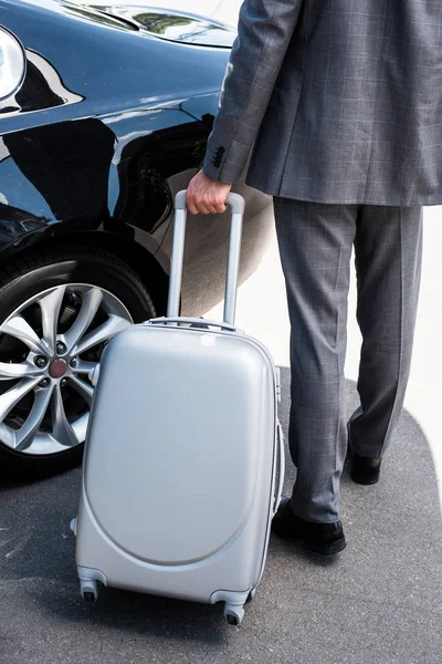 Cropped Image Businessman Carrying Wheeled Bag Car Street — стоковое фото