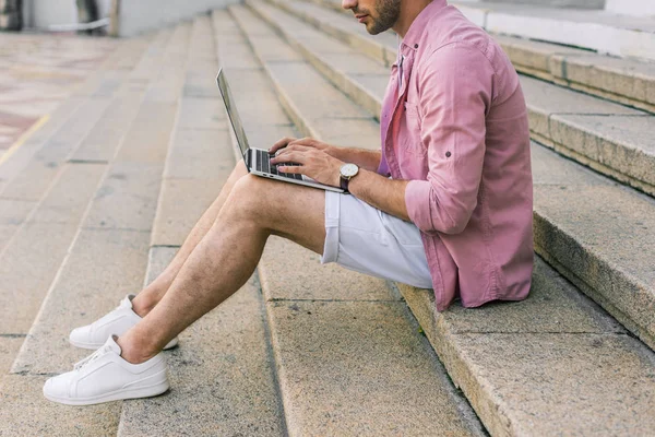 Partial View Man Using Laptop While Sitting Steps Street — стоковое фото