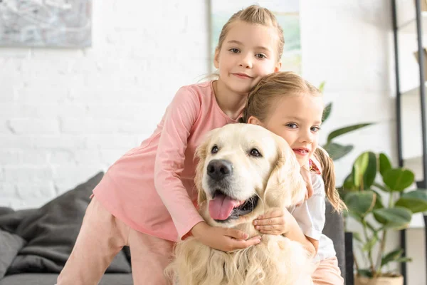 Portrait Adorable Kids Hugging Golden Retriever Dog Home — стоковое фото