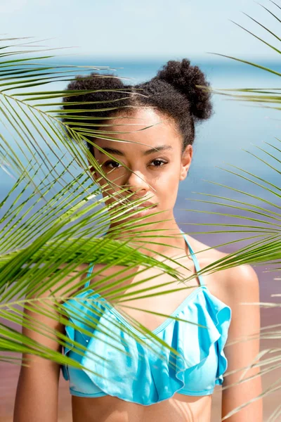 Portrait Serious African American Woman Palm Leaves Front Sea — стоковое фото