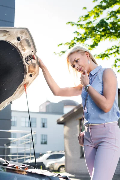 Side View Pensive Woman Looking Car Hood Broken Car Street — стоковое фото