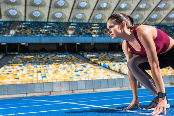 Athletic Female Runner Start Position Running Track Sports Stadium — стоковое фото