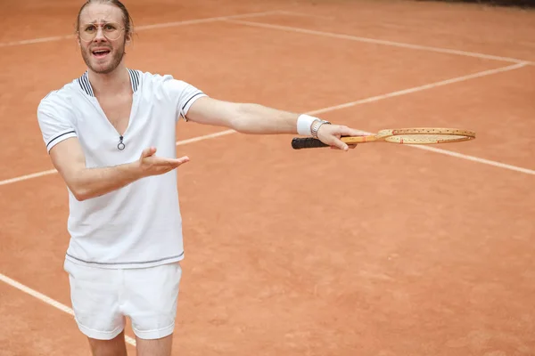 Worried Emotional Tennis Player Pointing Racket Tennis Court — стоковое фото