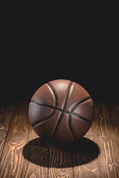 One Rubber Basketball Ball Wooden Floor Dark Room — стоковое фото
