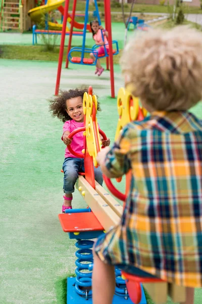 Rear View Boy Riding Rocking Horse Smiling African American Little Лицензионные Стоковые Фото