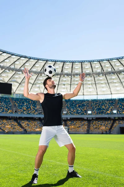 Handsome Young Soccer Player Balancing Ball Head Sports Stadium Лицензионные Стоковые Фото