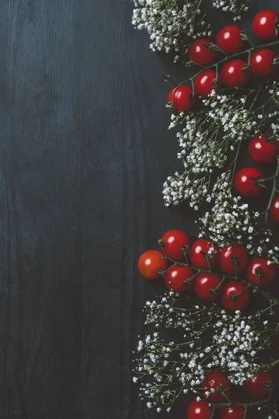 Top View Red Cherry Tomatoes White Flowers Black Wooden Background Стоковое Фото