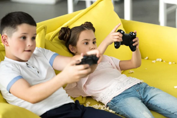 Serious Sister Brother Playing Video Game Home — стоковое фото