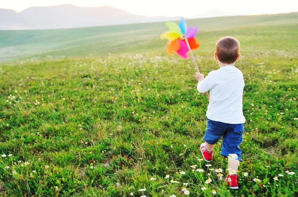 Happy child has fun outdoor Стоковая Картинка