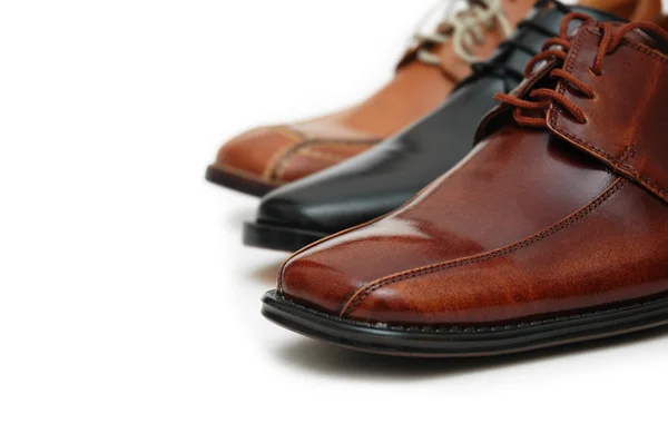 Выбор мужской обуви, изолированные на белом фоне Лицензионные Стоковые Фото