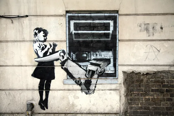Граффити Бэнкси "Банкомат — стоковое фото
