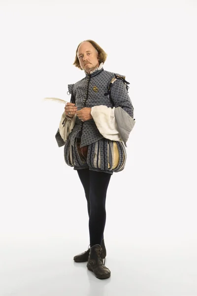Шекспир стоя с пером Стоковая Картинка