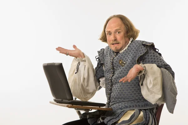 Шекспир с компьютером Стоковая Картинка
