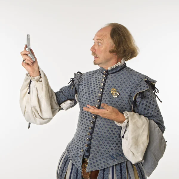 Шекспир, глядя на телефон Лицензионные Стоковые Изображения