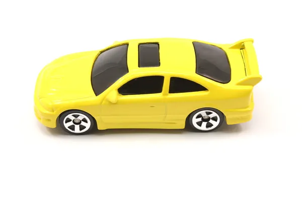 Желтый игрушка автомобиль купе — стоковое фото